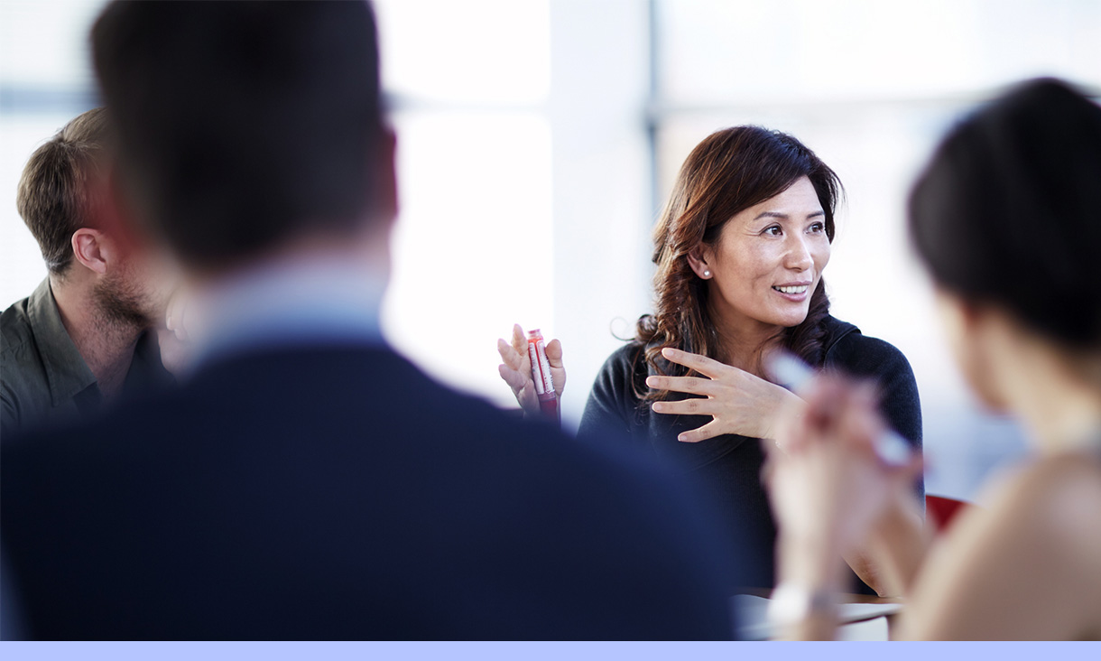 A group of people in a meeting.