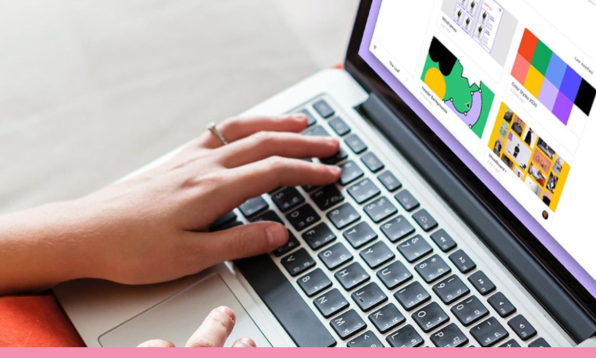 A person types on a latop.