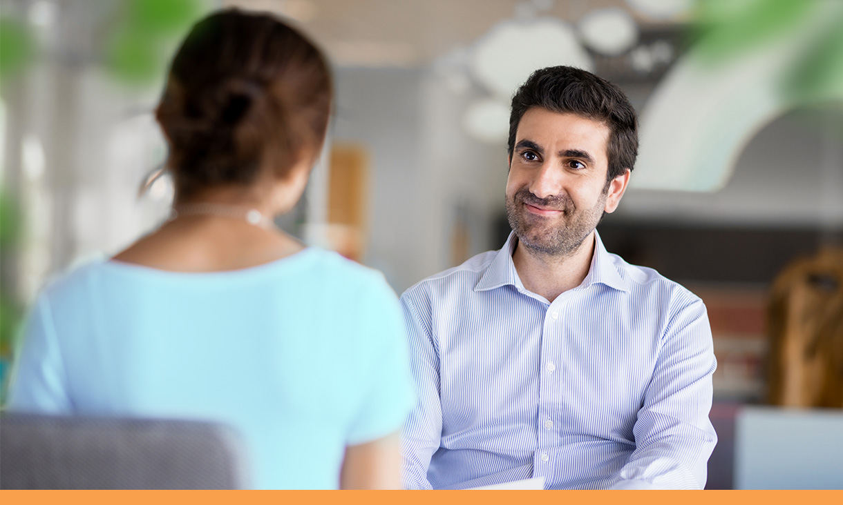 A hiring manager interviews a candidate.