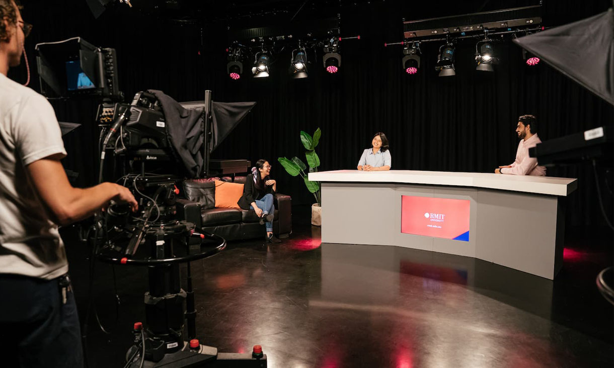 3 RMIT journalism students practice their interviewing skills in RMIT's studio facility.