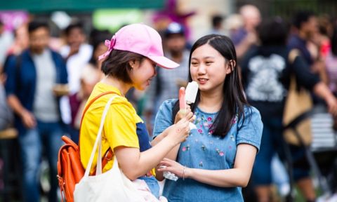 Students eating ice poles