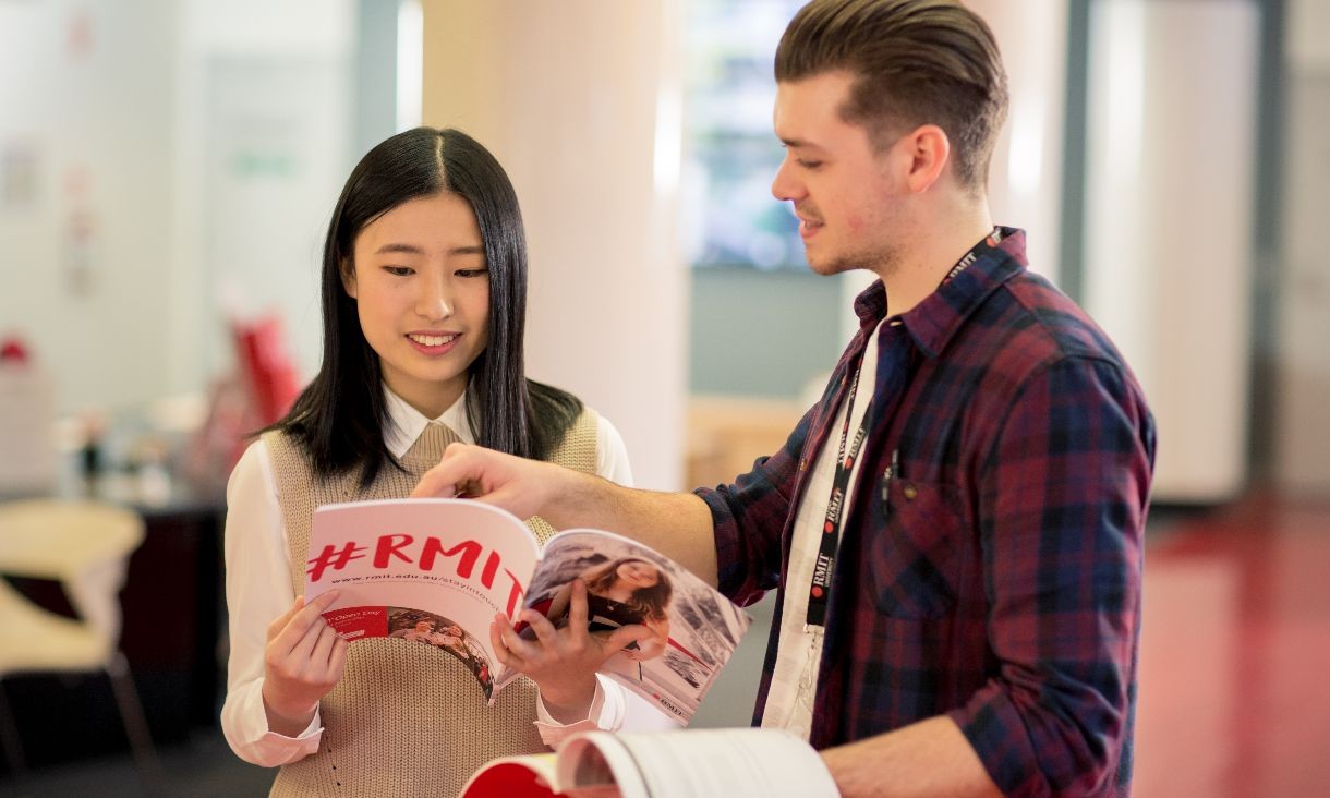 A female and male talking on campus